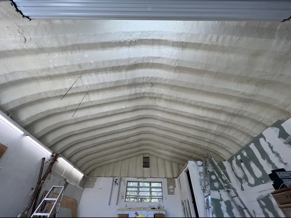 Spray polyurethane foam applied to the underside of a metal roof deck in Hayden